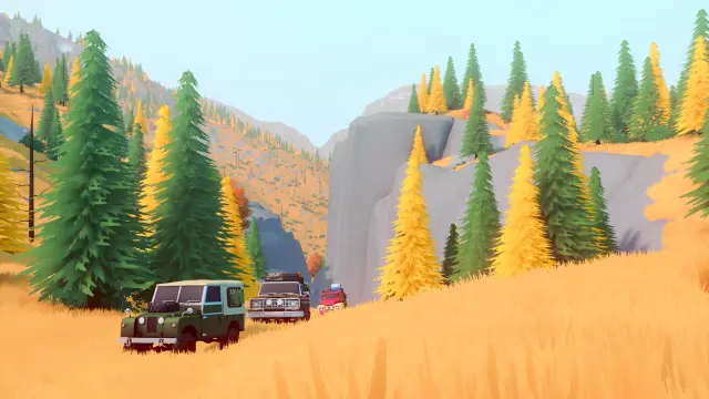 Three different off-road vehicles in a mountain convoy