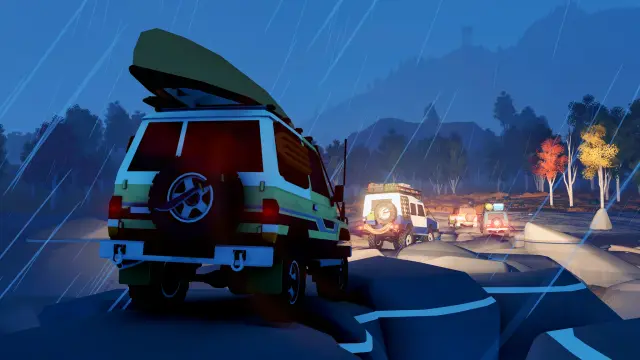 Four vehicles travelling together in heavy rain